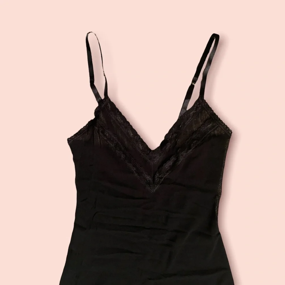 Sheer black negligeé with lace trim